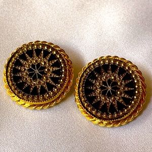 Gold tone metal & black glass stone clip earrings